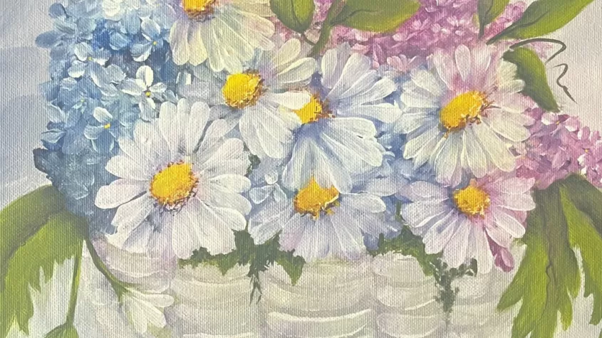 acrylic painting of a white basket with pastel spring flowers and fern leaves overflowing