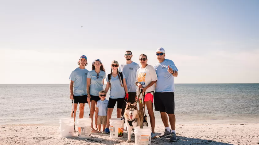 group of people at a beach cleanup 