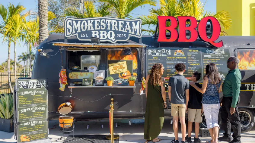 Family ordering food at BBQ truck