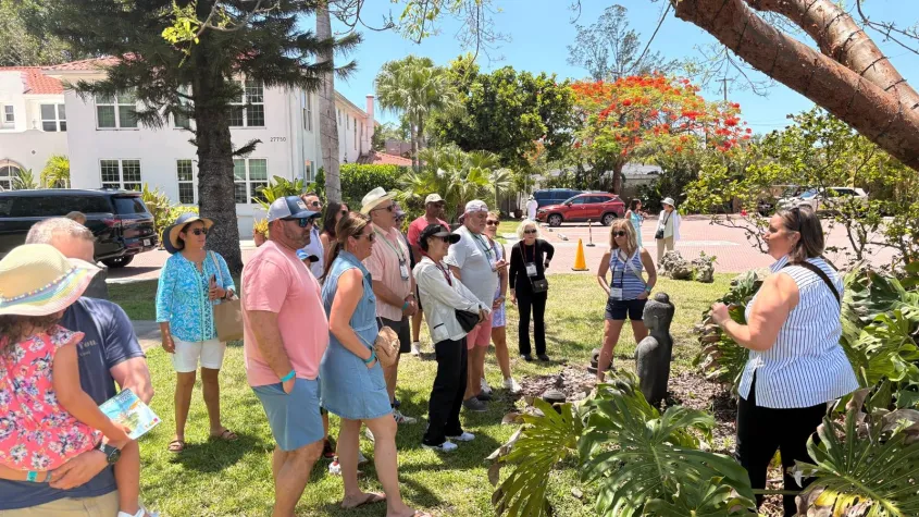 Group listening to tour guide at Shangri-La Resort in Bonita Springs