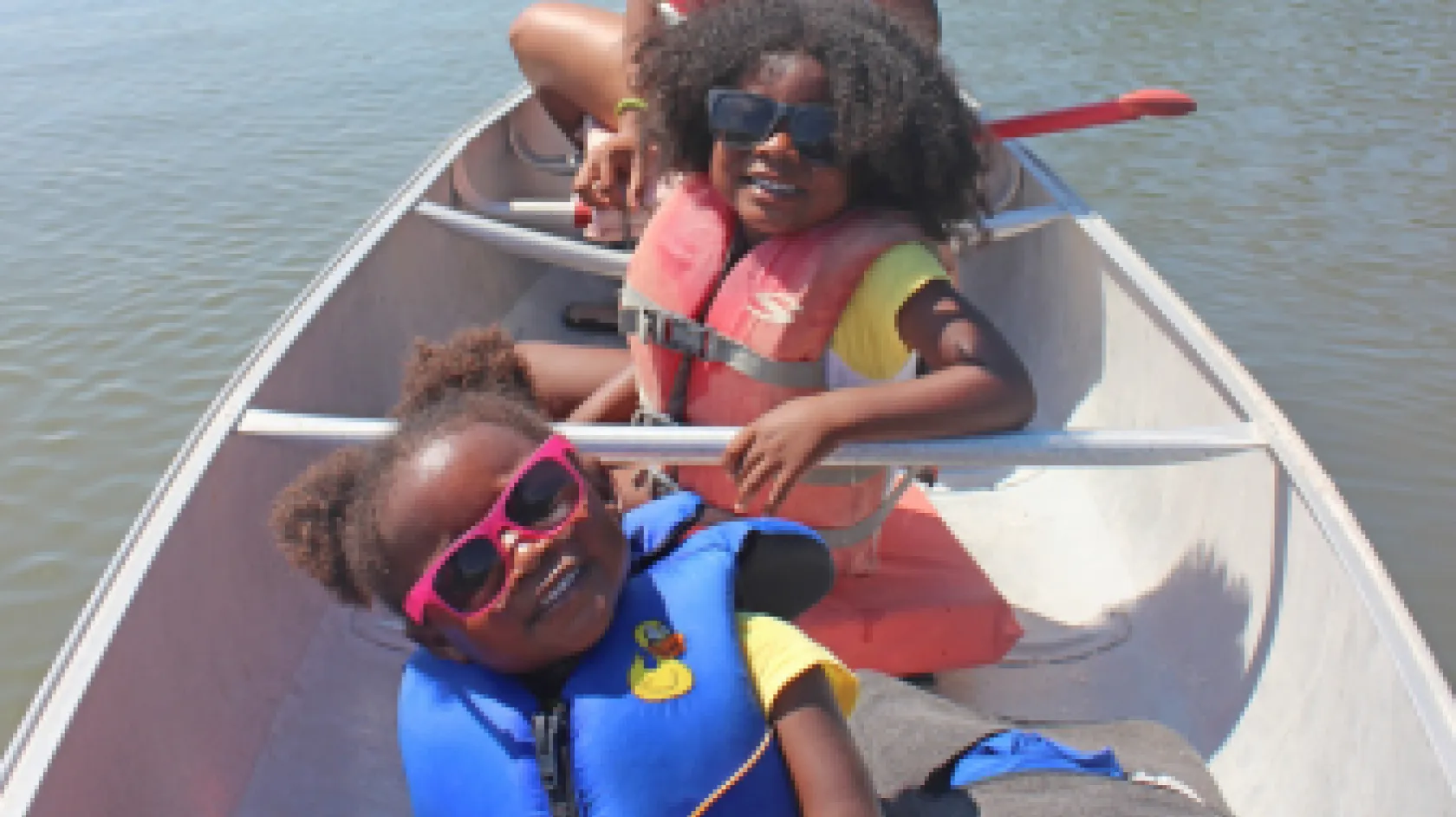 A mom and daughters enjoy canoeing on the Great Calusa Blueway Trail