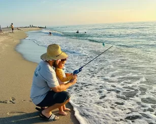 Strand-Fisch-Angel-Familienvater