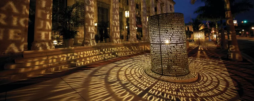 manuscripts sculpture at sidney berne davis art center lit up at night