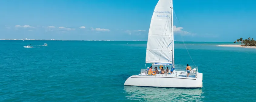 A sailboat drifts across pristine water near Sanibel Island
