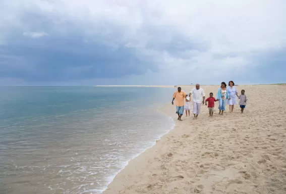 Family walking on the beach