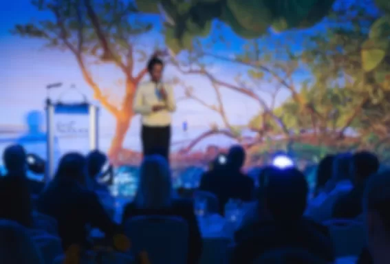 women presenting on stage