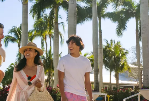 A family walks together at a resort