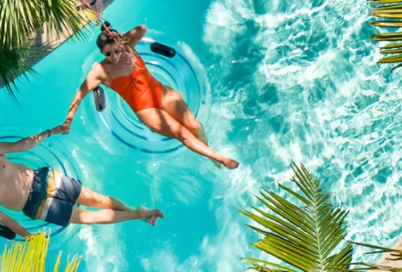 A couple enjoys a peaceful float down the lazy river at Hyatt Regency Coconut Point Resort & Spa