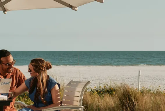 A couple enjoy dining on Fort Myers Beach