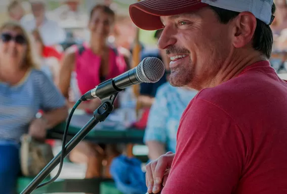 Male artist performing at outdoor concert