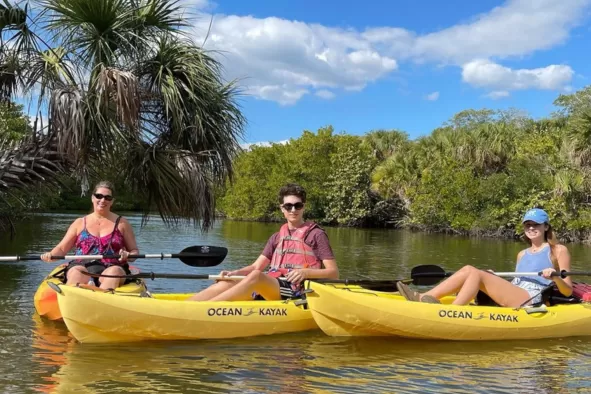 A family enjoys a kayak tour