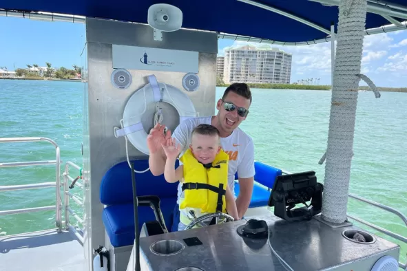 Dad and son enjoy boating