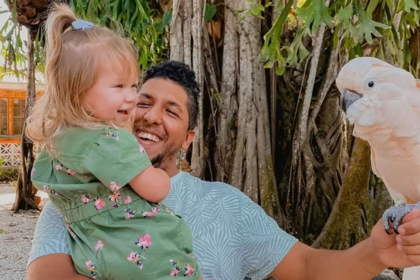 Father and daughter enjoy wildlife encounters at Wonder Gardens.