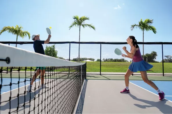A couple plays pickleball in the Fort Myers area.