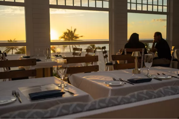 The sun sets over the water at the Crows Nest on Captiva Island