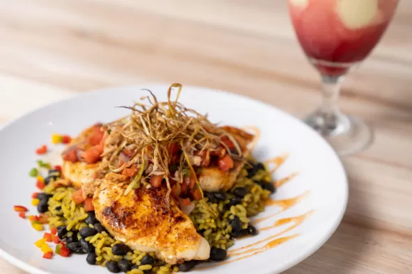 An entree featuring the catch of the day at Snug Harbor