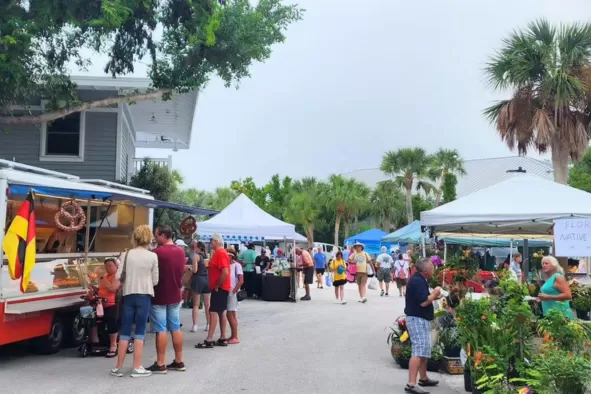 People shop at a local farmer's market