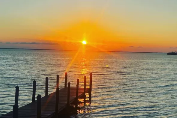 The sun sets over the water at Green Flash restaurant on Captiva Island