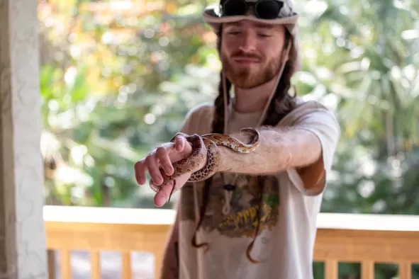 An employee at the Calusa Nature Center shows off a snake