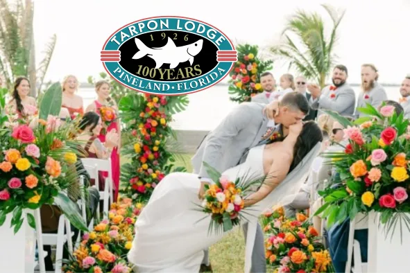 A couple kisses at their wedding ceremony