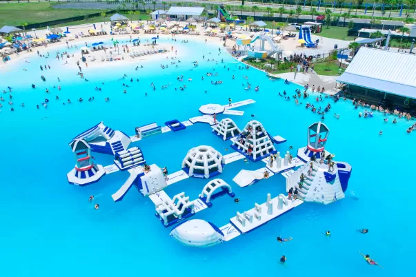 Drone shot view of crystal blue lagoon water and in-water obstacle course.