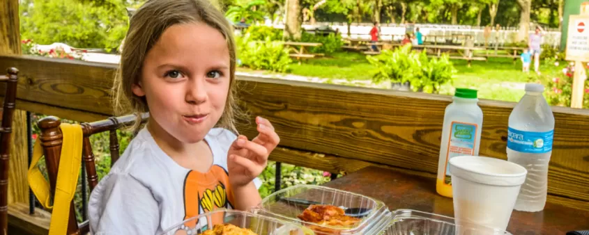 Girl eating food at Buckingham Farms